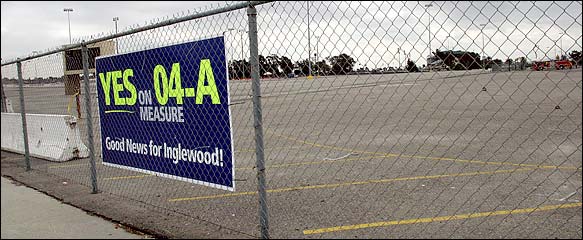 Voters in Inglewood, Calif., will decide on Tuesday whether to let Wal-Mart build a megastore on 60 acres of barren concrete by Hollywood Park racetrack.